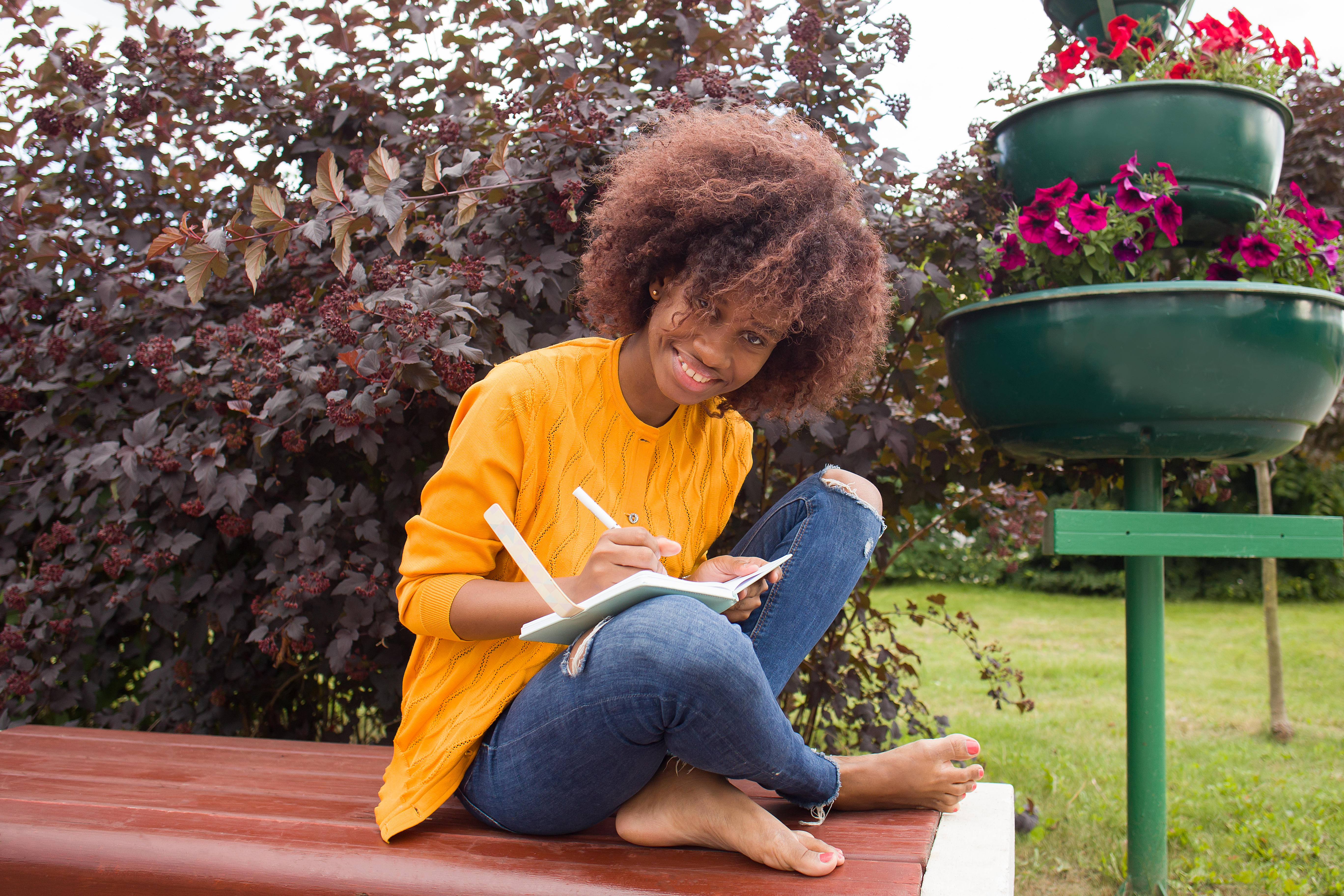 A Happy and young African American student in the park Week 1: your first page